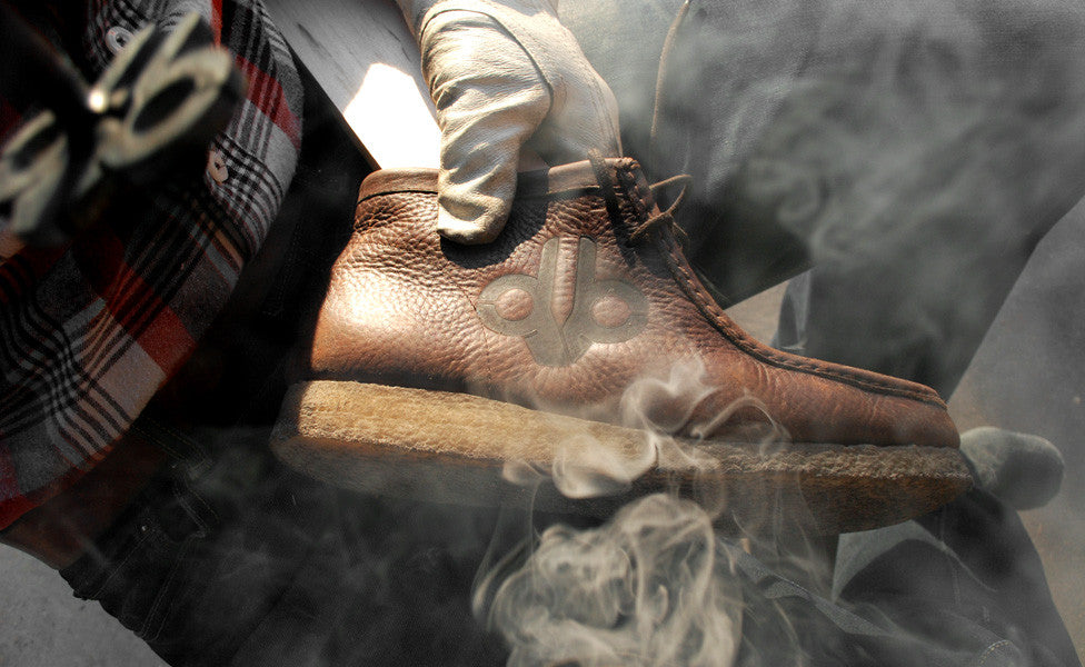 MILLARD TILLMAN BRANDS HIS SHOE